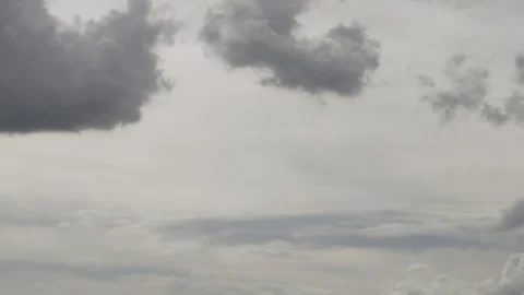 Beautiful Black Gray Puffy Clouds in Sunlight in Stormy Sky Slow Motion, Aerial  Stock Footage 264042282