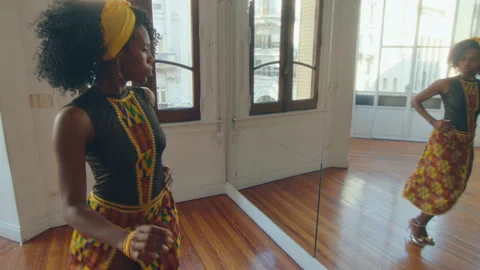 Beautiful Black Woman Practicing Tango Steps in a Dance Studio Stock Footage 246715807