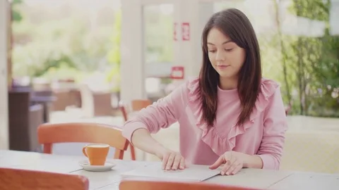Beautiful blogger using laptop at table in coffee shop Stock Footage 79659410