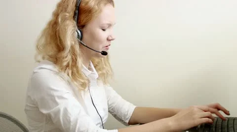Beautiful blond customer service worker helping out Video stock 12554091