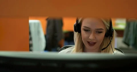 Beautiful blond help desk office support woman with headset Stock Footage