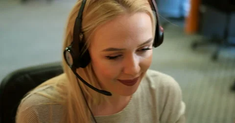 Beautiful blond help desk office support woman with headset Stock Footage 67299355