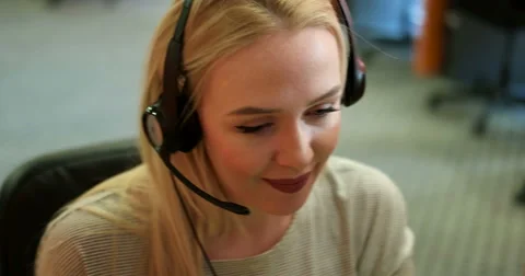 Beautiful blond help desk office support woman with headset Stock Footage 67313459