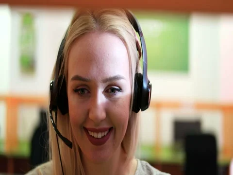 Beautiful blond help desk office support woman with headset Stock Footage 67314645