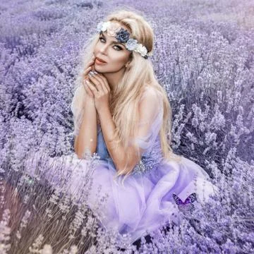 Beautiful blond model walking in spring or summer lavender field in sunrise Stock Photos