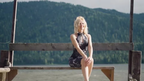 Beautiful blonde on the dock Stock Footage 205115307