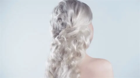 Beautiful blonde with a finger on her lips showing to keep silence, hush. 動画素材 59298717