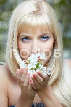 Beautiful blonde with flowers Stock Photos