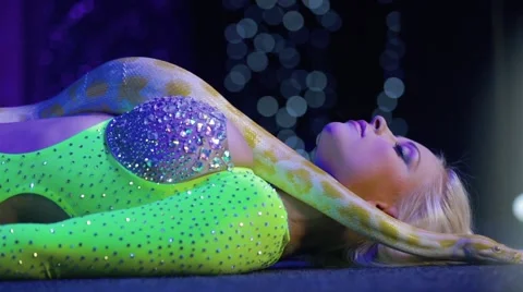 Beautiful blonde girl and python Stock Footage 61049877