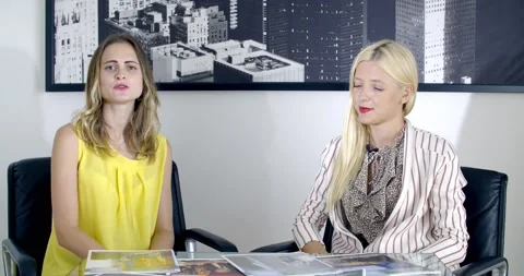Beautiful blonde lady an interview in the studio Video stock 139572441
