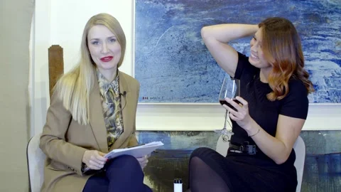 Beautiful blonde lady an interview in the studio Stock Footage 148749216