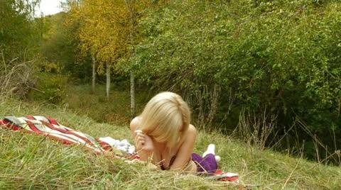 Beautiful Blonde Lying At Nature Stock-Footage 22322476