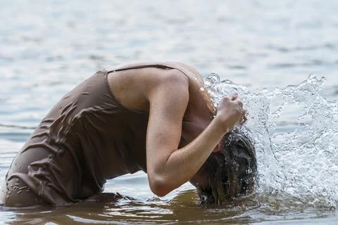 A Beautiful Blonde Model Enjoys A Day At The Lake Stock Photos