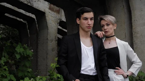 Beautiful blonde model puts hand on handsome man shoulder Stock Footage 115232860