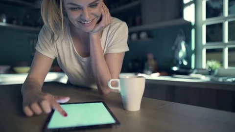 Beautiful blonde using tablet Stock Footage 74523297