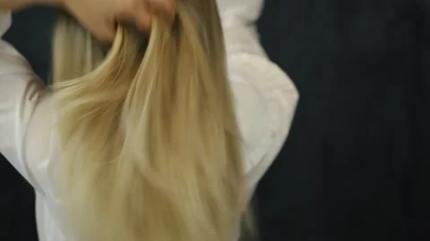 Beautiful blonde woman with long straight hair. Airtouch color technique Stock Footage