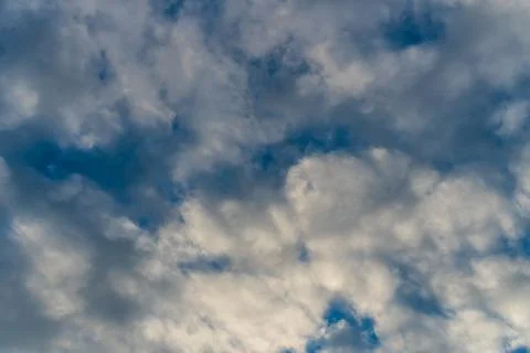 Beautiful blue clouds in the sunset sky Stock Photos