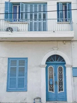 Beautiful blue door with windows in old building in Cyprus Fotos de archivo