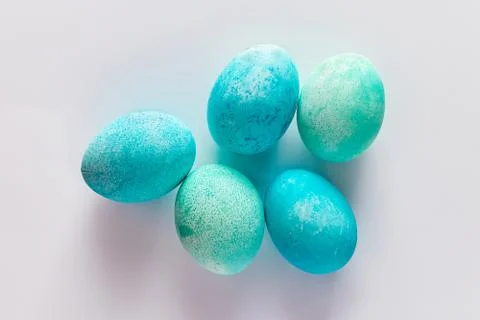 Beautiful blue easter eggs on a light background. Stock Photos