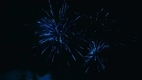 Beautiful blue fireworks exploding in the night sky Video stock 343160264