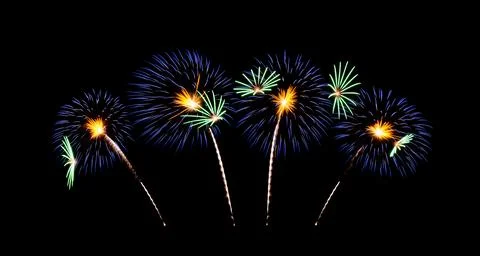 Beautiful blue fireworks exploding on night sky Stock Photos