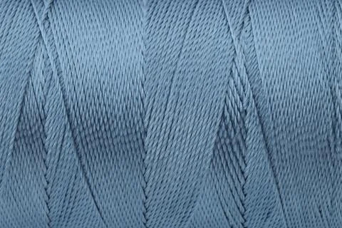 Beautiful blue sewing thread as background, closeup Stock Photos