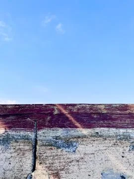 Beautiful Blue Sky and Clouds Seen from Behind a Textured Old Weathered Wooden Stock Photos