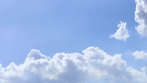 Beautiful blue sky background with clouds - comulus cloud in the sky timelapse Stock Footage 243247325