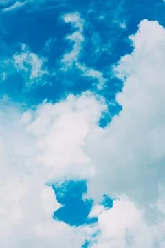 Beautiful blue sky with clouds background. Stock Photos