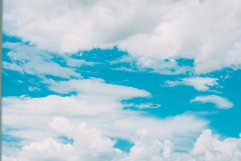 Beautiful blue sky with clouds background. Stock Photos