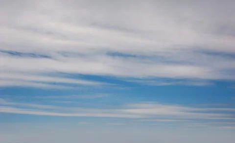 Beautiful blue sky with clouds, background for inscriptions Stock Photos