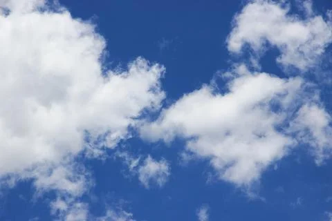 Beautiful blue sky with clouds background. Stock Photos