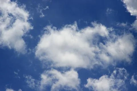 Beautiful blue sky with clouds background. Stock Photos