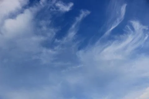 Beautiful blue sky with clouds background. Stock Photos