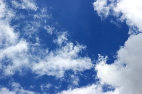 Beautiful blue sky with clouds background. Stock Photos