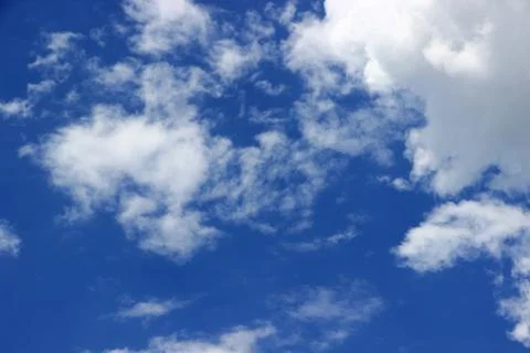 Beautiful blue sky with clouds background. Stock Photos