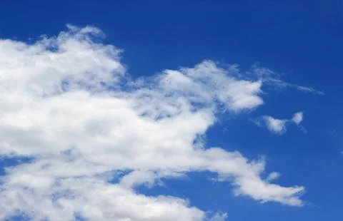 Beautiful blue sky with clouds background. Stock Photos