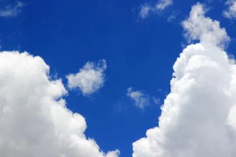 Beautiful blue sky with clouds background. Stock Photos