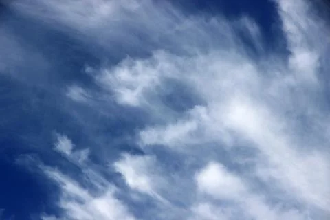Beautiful blue sky with clouds background. Stock Photos