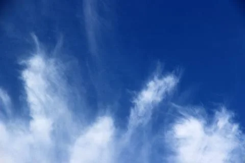Beautiful blue sky with clouds background. Stock Photos