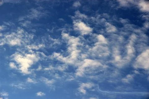 Beautiful blue sky with clouds background. Stock Photos