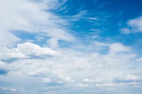 Beautiful Blue Sky with Dramatic Clouds. A Nature Spectacles backgrounds. Stock Photos