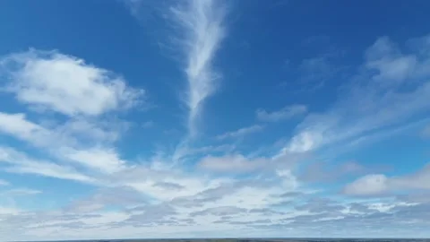 Beautiful Blue Sky with Dramatic White Clouds Drifting Over the Horizon Stock Footage 312417998