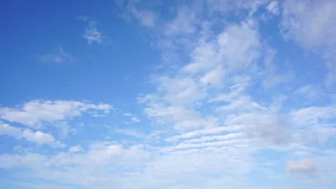 Beautiful blue sky with fluffy white clouds moving slowly on a sunny day Stock Footage 340183838