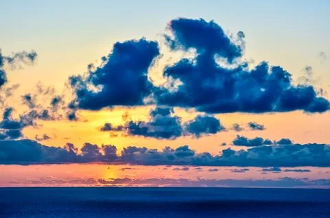 A beautiful blue sky with a large cloud in the middle Stock Photos