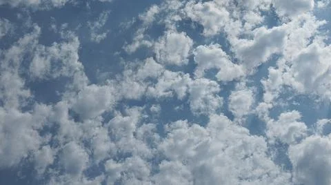 Beautiful blue sky with patterned altocumulus clouds Stock Photos