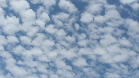 Beautiful blue sky with patterned altocumulus clouds Stock Photos