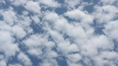 Beautiful blue sky with patterned altocumulus clouds Stock Photos