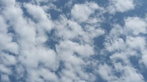 Beautiful blue sky with patterned altocumulus clouds Stock Photos