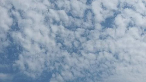 Beautiful blue sky with patterned altocumulus clouds Stock Photos
